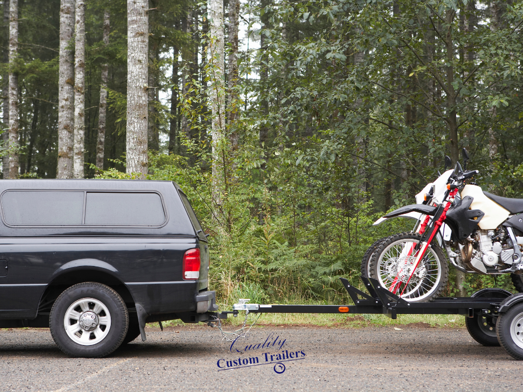 Custom trailer transporting motorcycles for long-distance travel